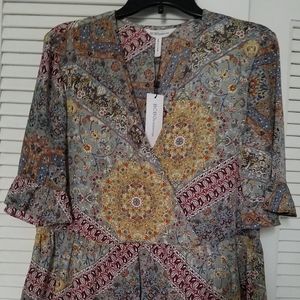 Floral peplum cross front blouse
